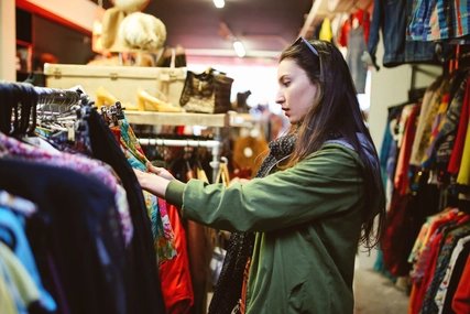 A girl is shopping vintage and second hand clothes