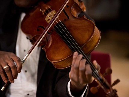 Midsection Of Man Playing Violin